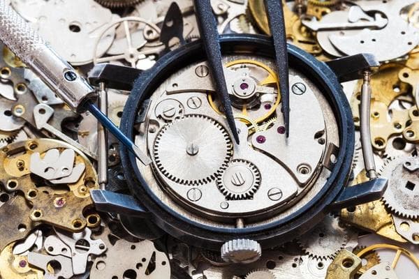 Watch technician repairing a watch